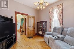 Front hall leads to this den. - 