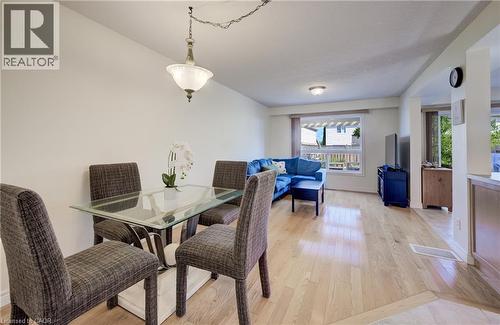 Open-concept living area with wood-finish flooring - 496 Langlaw Drive, Cambridge, ON - Indoor Photo Showing Dining Room