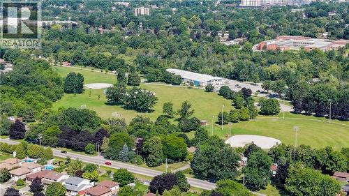 Expansive green space featuring large athletic fields and a baseball diamond, surrounded by mature trees - 496 Langlaw Drive, Cambridge, ON - Outdoor