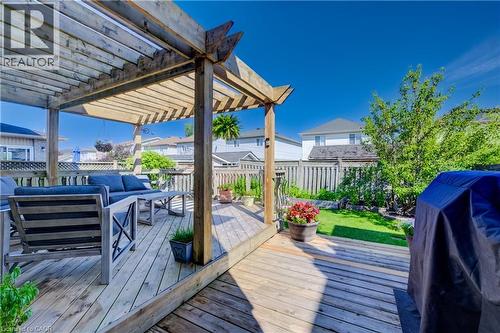 Expansive wood-finish deck featuring a slatted pergola structure - 496 Langlaw Drive, Cambridge, ON - Outdoor With Deck Patio Veranda