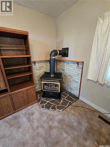 Mccormick Acreage, Weyburn Rm No. 67, SK - Indoor Photo Showing Other Room With Fireplace
