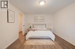 Neutral tone walls complement wood-finish flooring - 