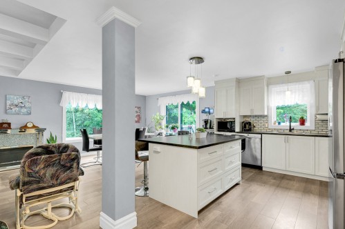 Cuisine - 110 Rue Philipon, Saint-Calixte, QC - Indoor Photo Showing Kitchen With Fireplace