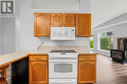2233 6Th St E, Courtenay, BC - Indoor Photo Showing Kitchen With Fireplace