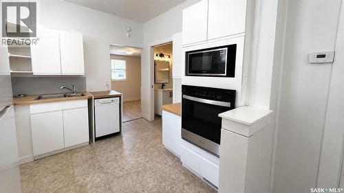 413 L Avenue N, Saskatoon, SK - Indoor Photo Showing Kitchen With Fireplace