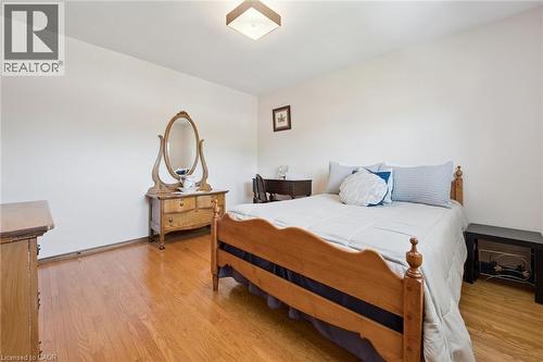 Hardwood flooring throughout - 18 Strathcona Crescent, Kitchener, ON - Indoor Photo Showing Bedroom