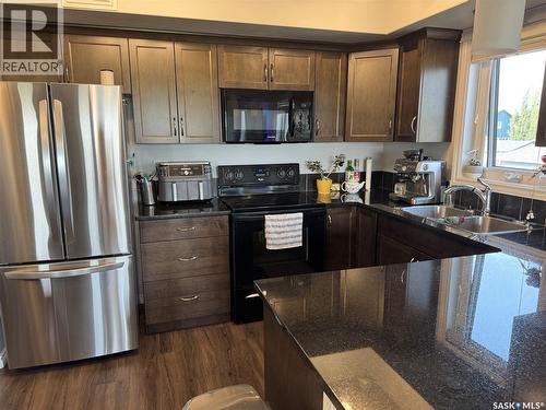 108 210 Rajput Way, Saskatoon, SK - Indoor Photo Showing Kitchen With Double Sink