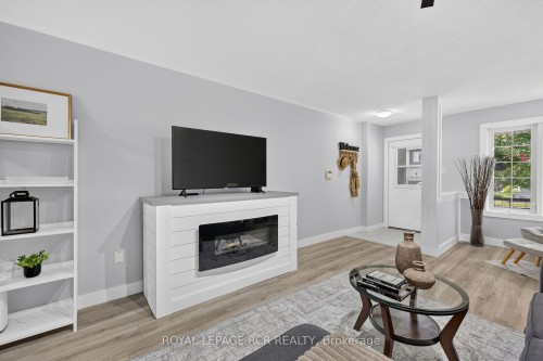 95 Waters Boulevard, Milton, ON - Indoor Photo Showing Living Room With Fireplace