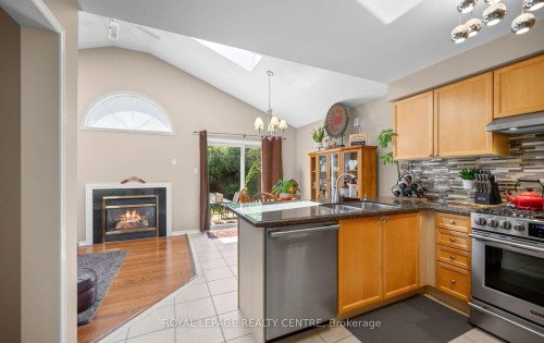 3092 Owls Foot Drive, Mississauga, ON - Indoor Photo Showing Kitchen With Fireplace With Double Sink