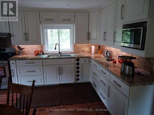 4 Pinewood Drive, Tiny, ON - Indoor Photo Showing Kitchen With Double Sink