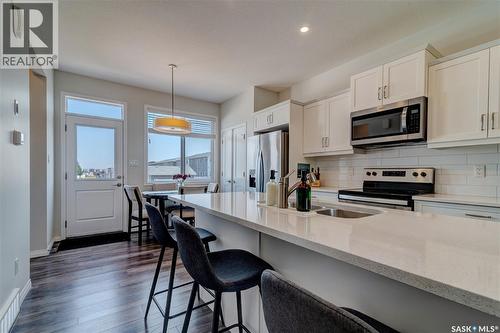 3277 Chuka Boulevard, Regina, SK - Indoor Photo Showing Kitchen With Stainless Steel Kitchen With Double Sink With Upgraded Kitchen