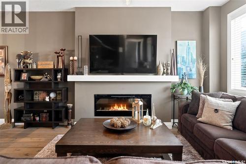 5413 Green Silverberry Drive E, Regina, SK - Indoor Photo Showing Living Room With Fireplace