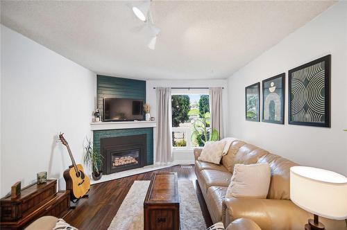 19 Lechman Place, Winnipeg, MB - Indoor Photo Showing Living Room With Fireplace