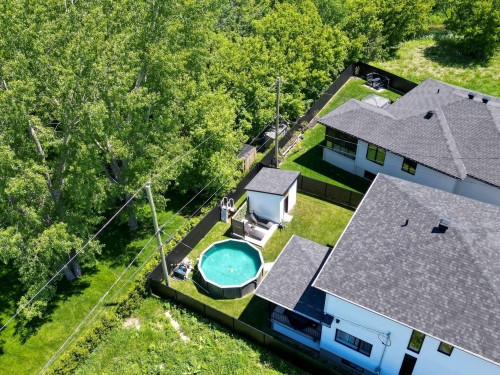 Vue d'ensemble - 17 Place De La Rive, Saint-Mathieu, QC - Outdoor With Above Ground Pool