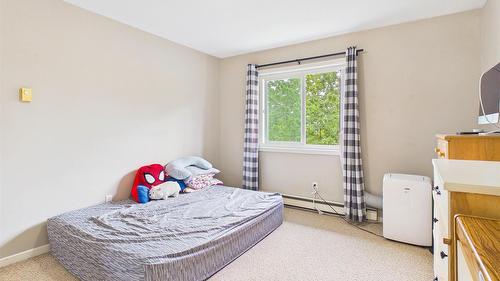 303-993 Klo Road, Kelowna, BC - Indoor Photo Showing Bedroom