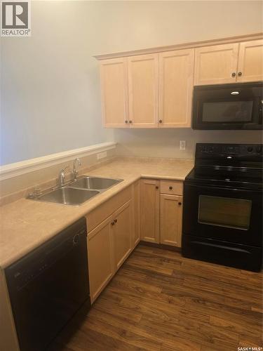 53 4425 Nicurity Drive, Regina, SK - Indoor Photo Showing Kitchen With Double Sink