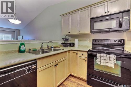 53 4425 Nicurity Drive, Regina, SK - Indoor Photo Showing Kitchen With Double Sink