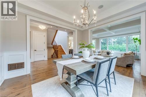 Dining area featuring a decorative chandelier and wood-finish flooring - 436 Willis Drive, Oakville, ON - Indoor Photo Showing Dining Room