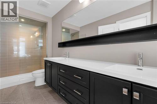 Double vanity with integrated sinks and dark wood-finish cabinetry - 2 Waterview Lane, Grimsby, ON - Indoor Photo Showing Bathroom
