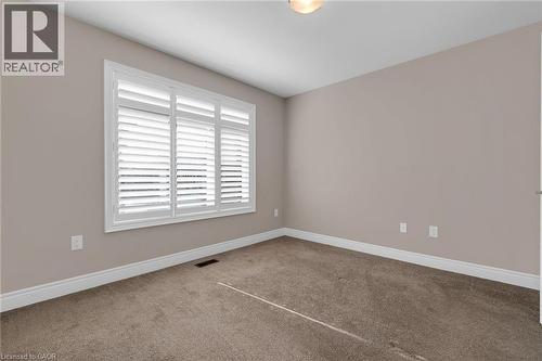 Room with neutral wall paint and brown carpet flooring - 2 Waterview Lane, Grimsby, ON - Indoor Photo Showing Other Room