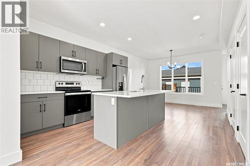 115 Rosewood Boulevard E, Saskatoon, SK - Indoor Photo Showing Kitchen With Stainless Steel Kitchen With Upgraded Kitchen