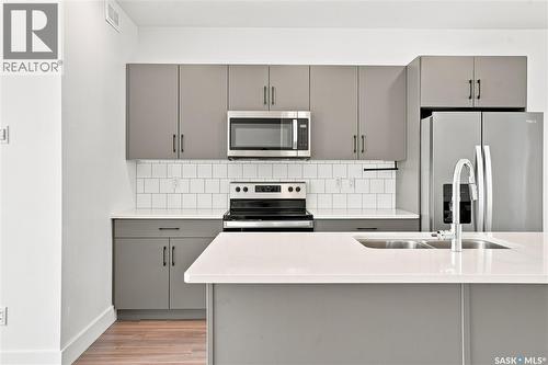 115 Rosewood Boulevard E, Saskatoon, SK - Indoor Photo Showing Kitchen With Stainless Steel Kitchen With Double Sink