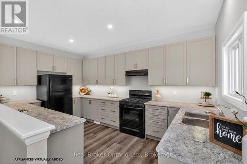 90 14 Concession E, Tiny, ON - Indoor Photo Showing Kitchen With Double Sink