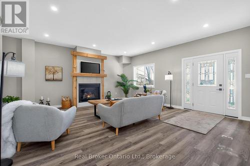 90 14 Concession E, Tiny, ON - Indoor Photo Showing Living Room With Fireplace