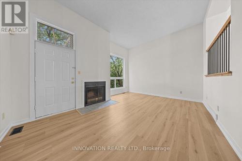 2 - 76 Esterlawn Private, Ottawa, ON - Indoor Photo Showing Other Room With Fireplace