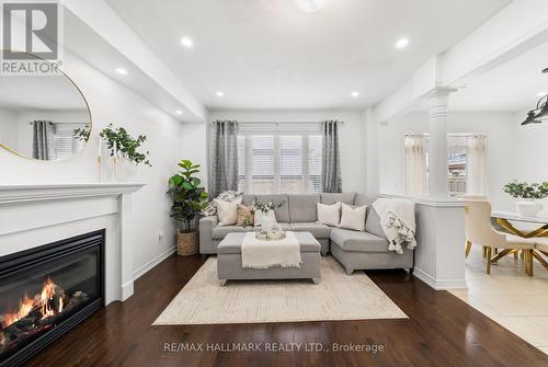 upgraded trim, gas fireplace and potlights. - 152 Mcdonald Crescent, Clarington, ON - Indoor Photo Showing Living Room With Fireplace