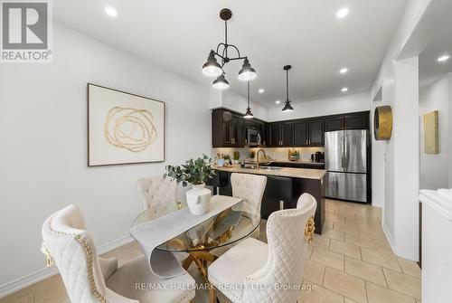 updated pendant lighting over sink and breakfast - 152 Mcdonald Crescent, Clarington, ON - Indoor Photo Showing Dining Room