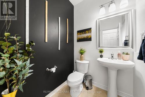 Updated Powder Room with pedestal and new mirror - 152 Mcdonald Crescent, Clarington, ON - Indoor Photo Showing Bathroom