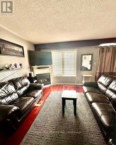12 Bonello Crescent, Whitby, ON - Indoor Photo Showing Living Room With Fireplace