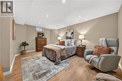 Bedroom featuring wood-finish flooring, recessed lighting, and neutral wall tones - 24 Knack Lane, Cambridge, ON - Indoor Photo Showing Bedroom