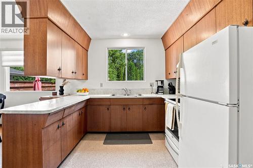 57 Potter Crescent, Saskatoon, SK - Indoor Photo Showing Kitchen With Double Sink