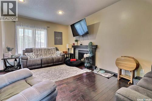 71 Fairway Crescent, White City, SK - Indoor Photo Showing Living Room With Fireplace