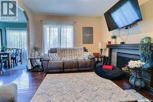 71 Fairway Crescent, White City, SK - Indoor Photo Showing Living Room With Fireplace