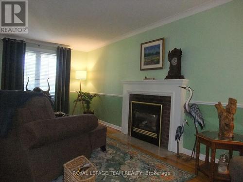 Gas fireplace with remote. - 32 Gary Crescent, Arnprior, ON - Indoor Photo Showing Living Room With Fireplace