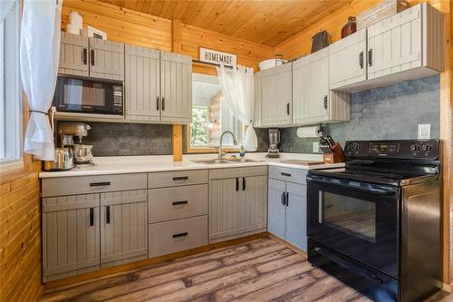 24 Wall Street, Zhoda, MB - Indoor Photo Showing Kitchen With Double Sink