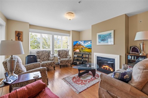 #308-1620 Townsite Rd, Nanaimo, BC - Indoor Photo Showing Living Room With Fireplace