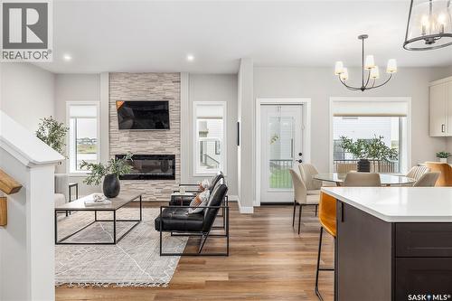 3012 Favel Drive, Regina, SK - Indoor Photo Showing Living Room With Fireplace