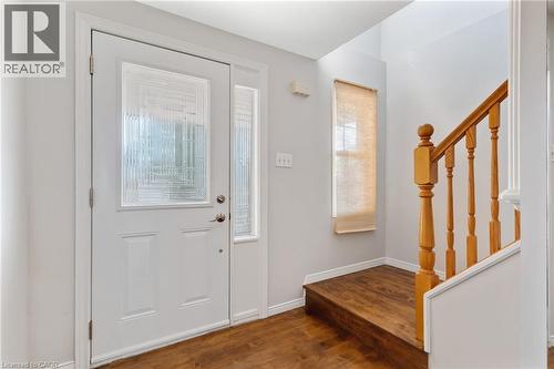 Entryway featuring a white paneled door with decorative glass inserts and a matching sidelight - 129 Kovac Road, Cambridge, ON - Indoor Photo Showing Other Room