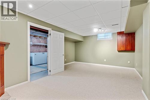Carpeted room with recessed lighting and a drop ceiling - 129 Kovac Road, Cambridge, ON - Indoor Photo Showing Basement