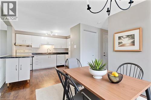 Open-concept kitchen and dining area featuring wood-finish flooring - 129 Kovac Road, Cambridge, ON - Indoor