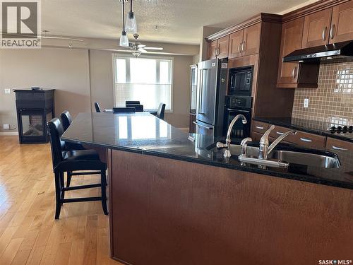 205 75 Souris Avenue, Weyburn, SK - Indoor Photo Showing Kitchen With Double Sink With Upgraded Kitchen
