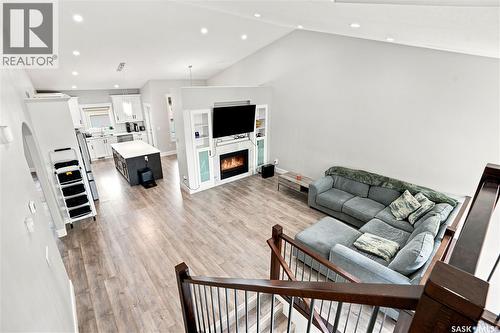 670 Fast Crescent, Saskatoon, SK - Indoor Photo Showing Other Room With Fireplace