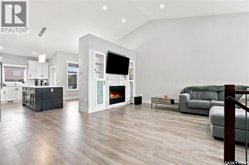 670 Fast Crescent, Saskatoon, SK - Indoor Photo Showing Other Room With Fireplace