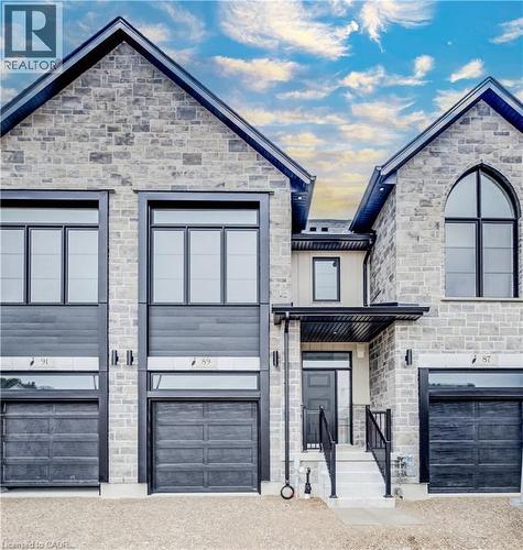 Stone and siding facade featuring multiple gabled roofs - 89 Rivergreen Crescent, Cambridge, ON - Outdoor