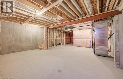 Unfinished basement with concrete flooring and exposed wood framing - 89 Rivergreen Crescent, Cambridge, ON - Indoor Photo Showing Basement