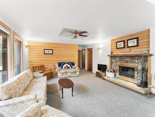 28 Lakeview Dr, Alexander, MB - Indoor Photo Showing Living Room With Fireplace